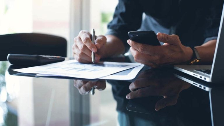 Business owner filling out documents.