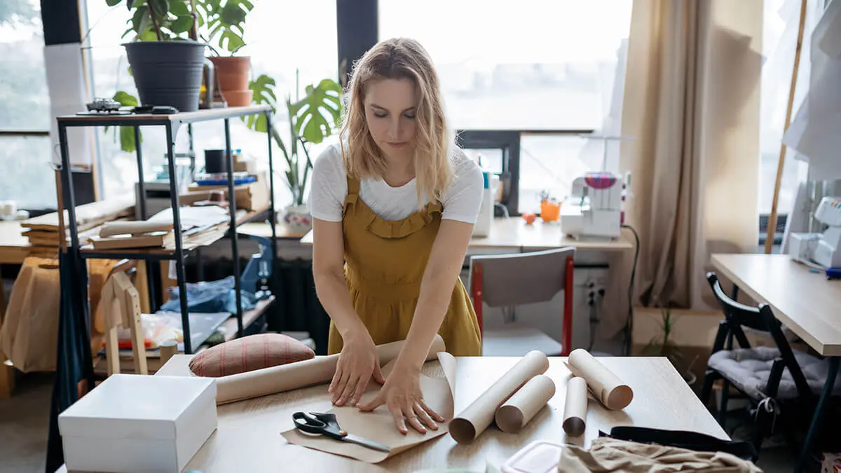 Business owner wrapping products