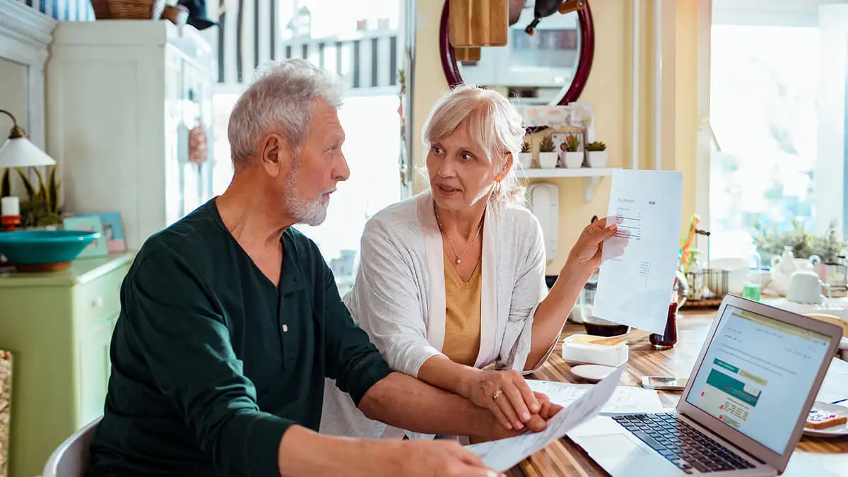 Husband and wife reviewing employee pension