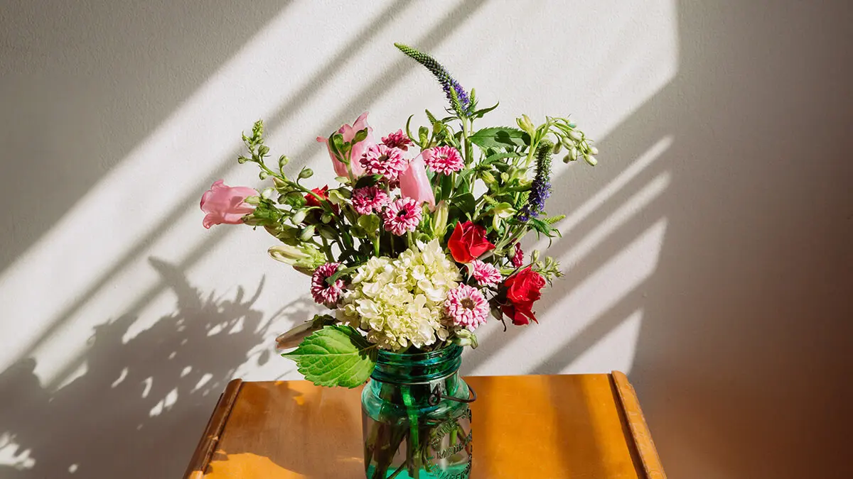 Bereavement flowers on a table.