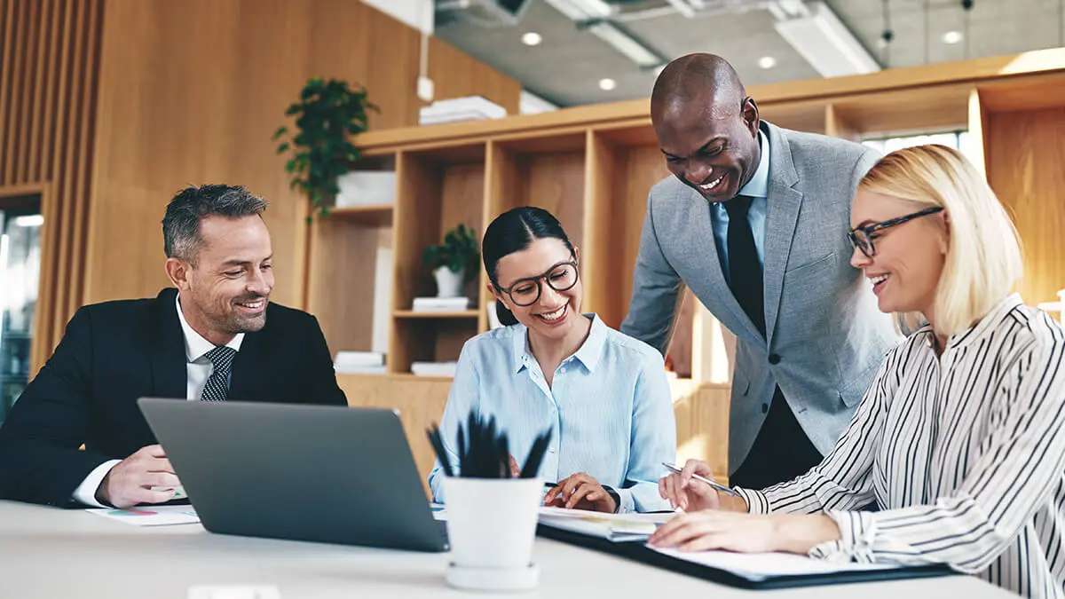 A group of four accountants working together.