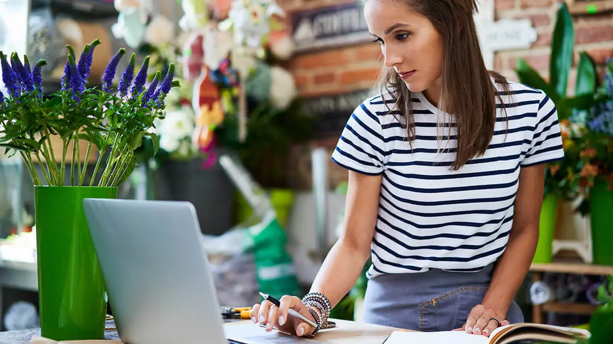 Self-employed woman using a computer.