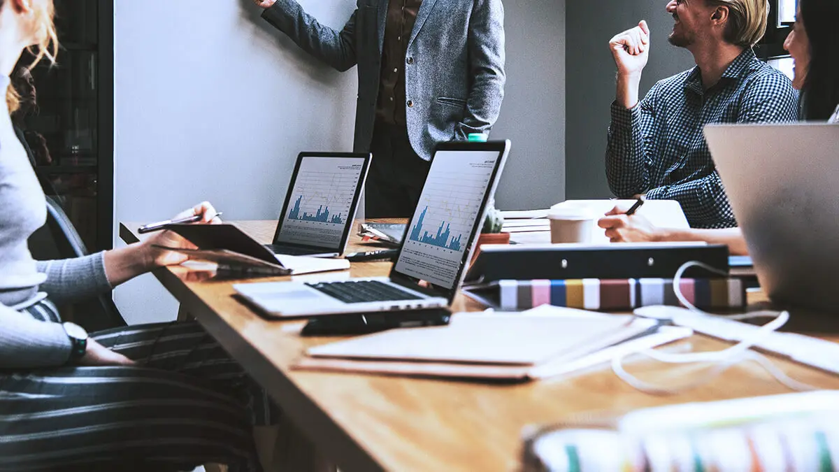 Employees in a meeting discussing business equity