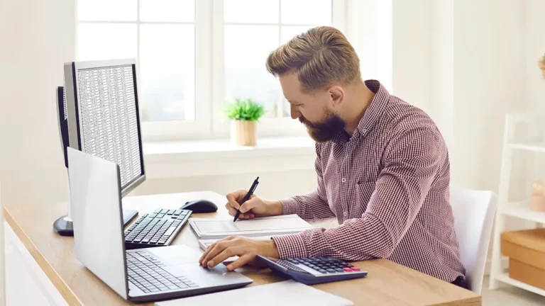 Man learning how to use accounting software