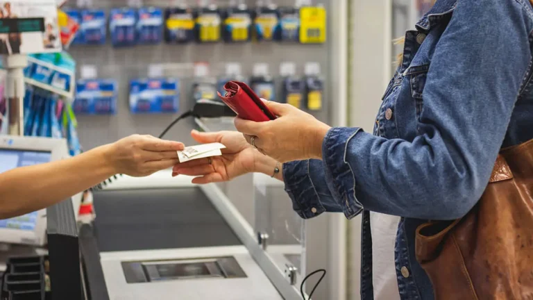 Customer paying sales tax at the point of sale.