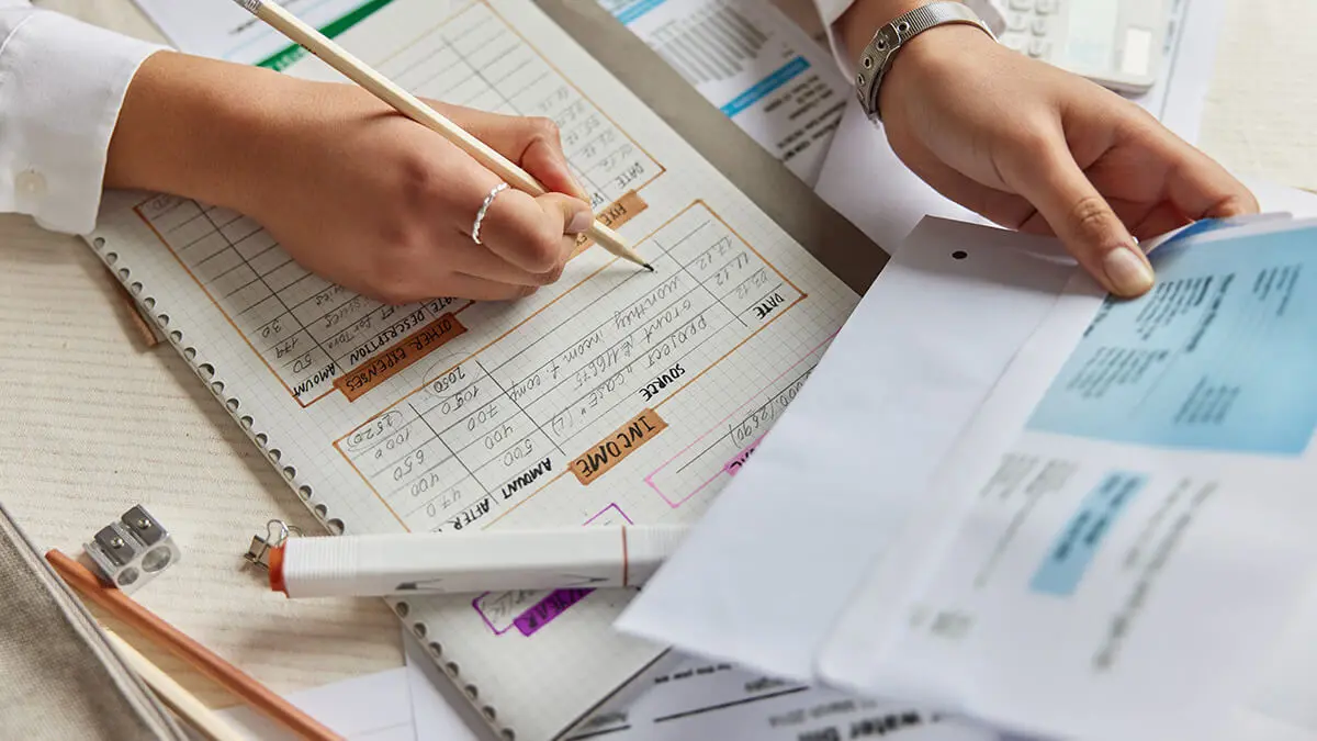 Woman looking at business receipts for taxes.