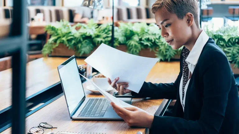 Business owner reviewing paperwork