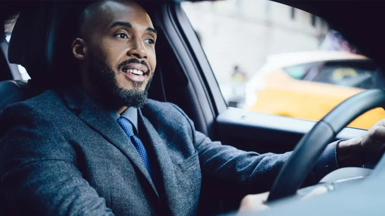 Man driving a car.