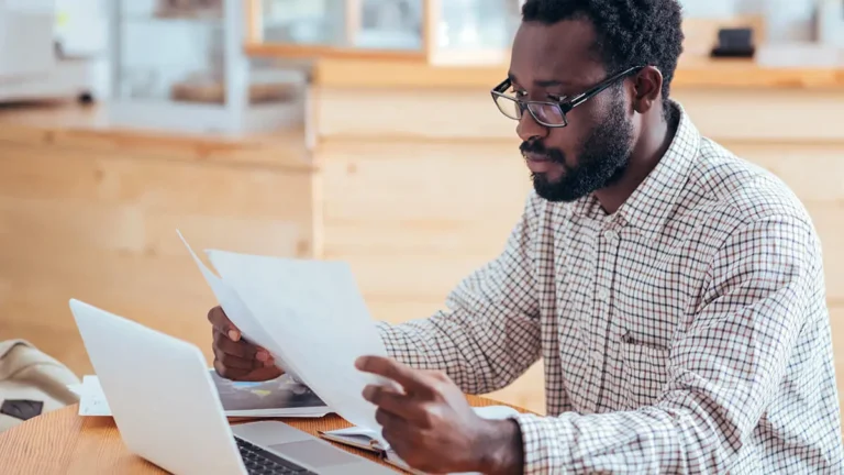 Man reviewing self-employment tax deductions