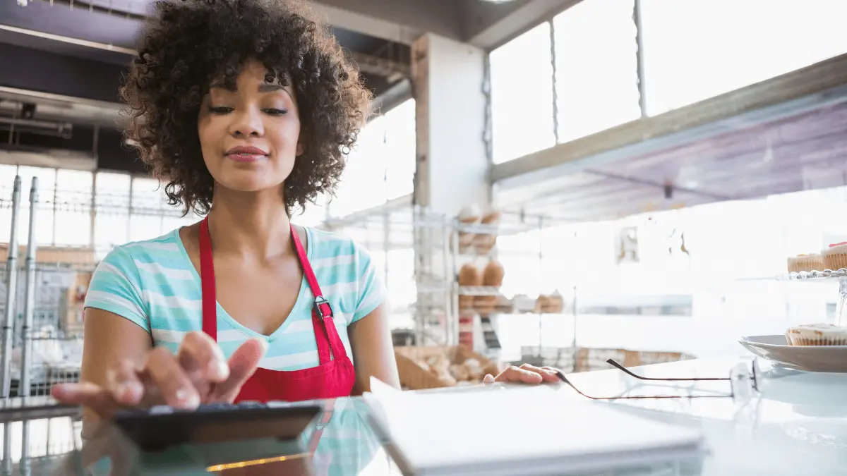 Restaurant owner calculates hours worked for her employees.