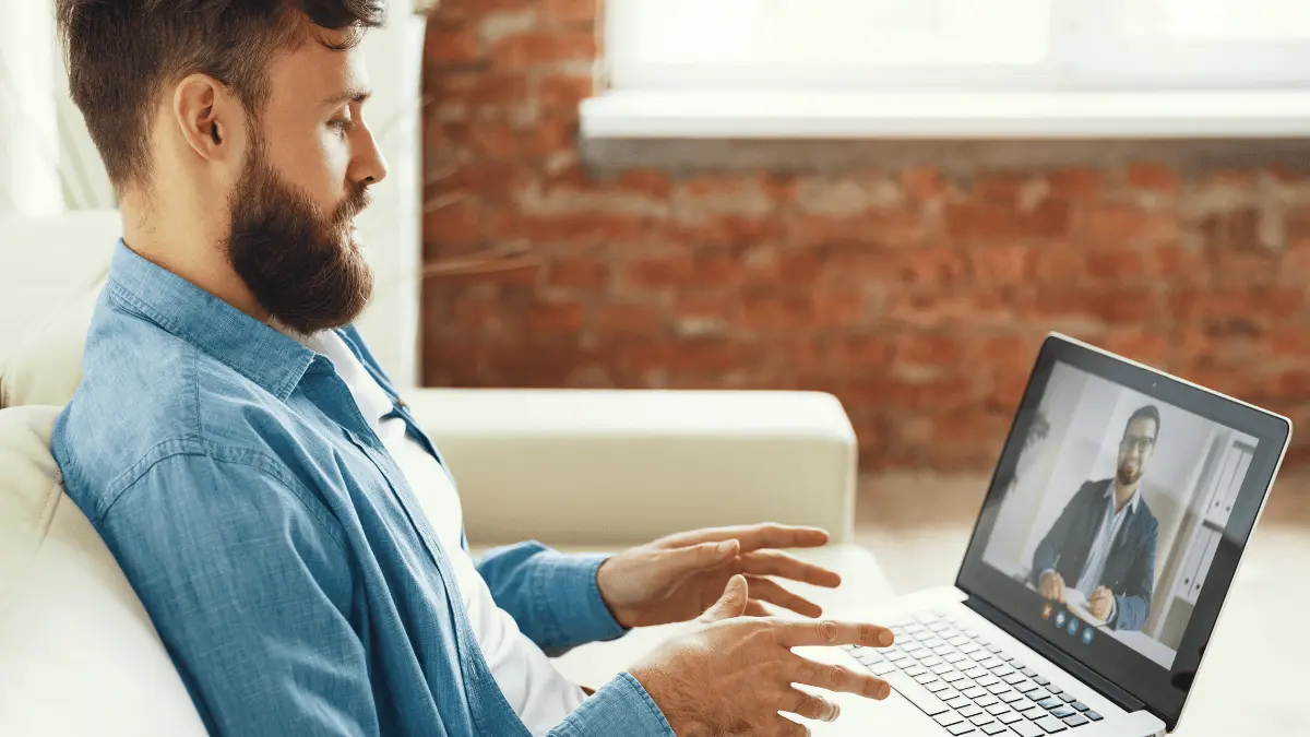 Employee taking advantage of employee assistance program with video counseling.