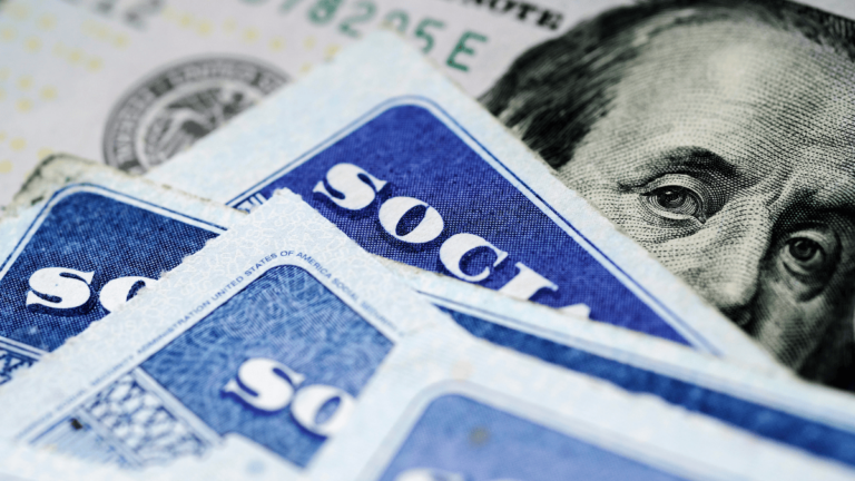 Social Security cards and a $100 bill