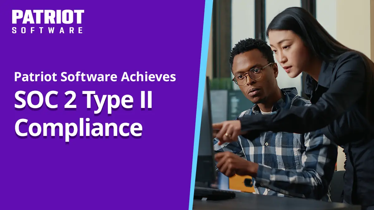 two people looking at computer reading about soc 2 type II compliance
