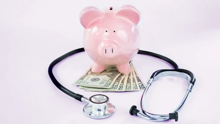 Piggy bank, money, and stethoscope